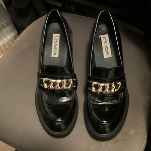 Steve Madden Glossy Black Loafers with Gold Accent